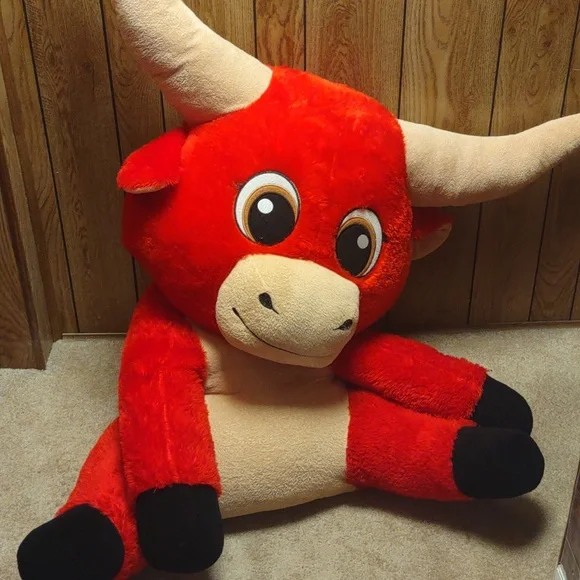 A very big stuffed animal bull it's at least 3ft tall and it's  red,black,and tan - Main Image